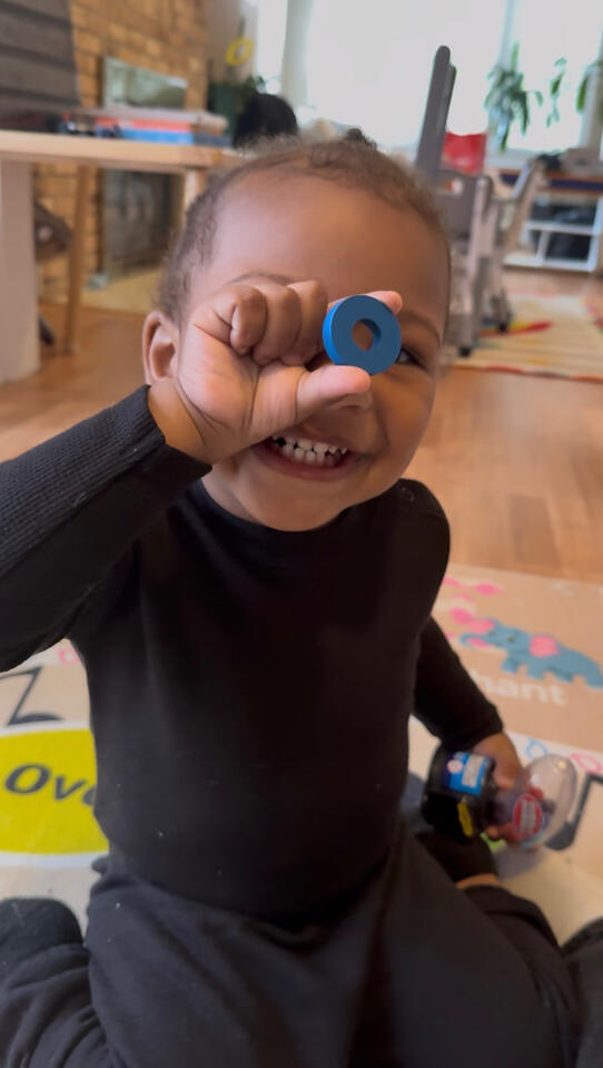 Learning Through Play Child participating in a hands-on learning activity at Advanced Childcare Services LLC